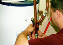 Grapevine water heater repair specialist adjusts intake pipe